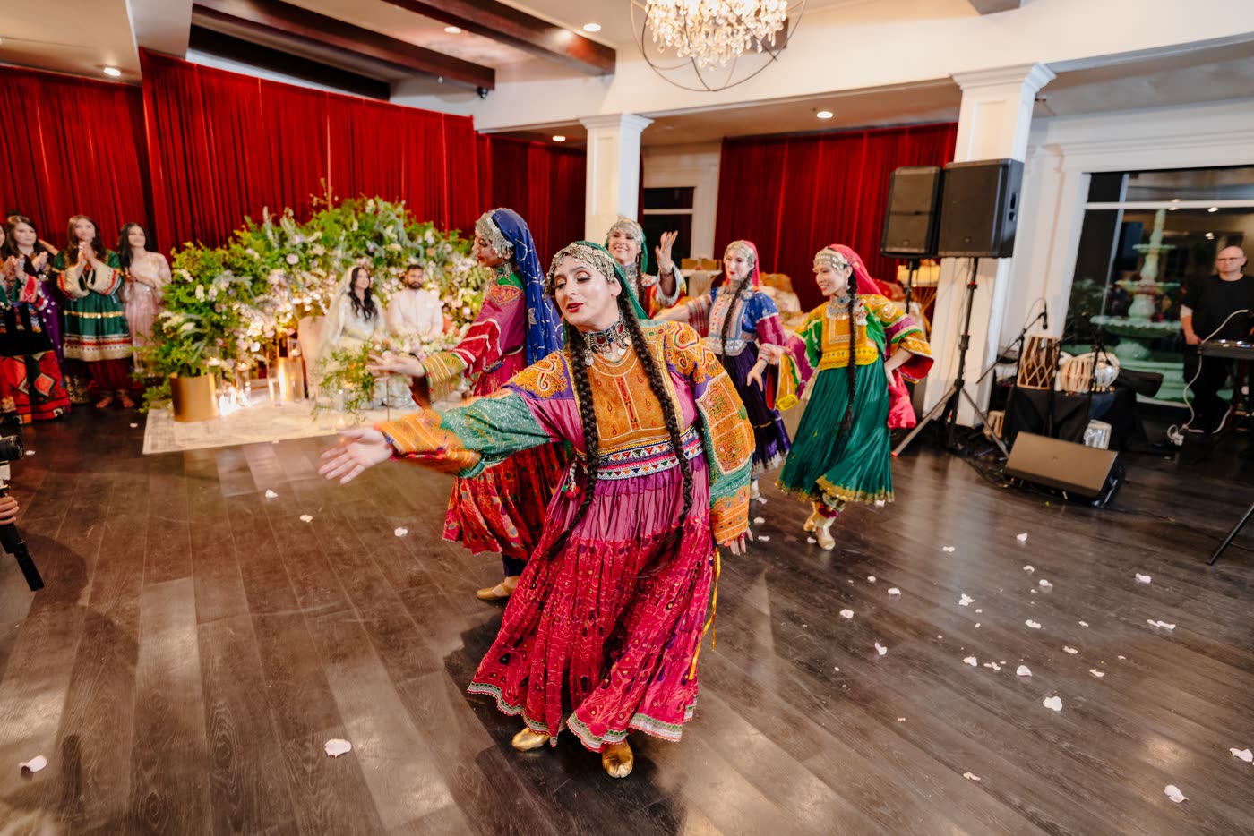 Dancers with embroidered veils dancing across the floor